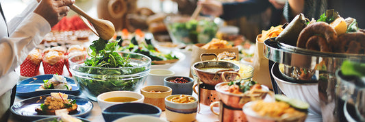 Party table with pasta and salad options