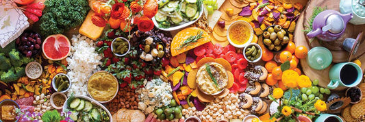 A large group of food on charcuterie board.