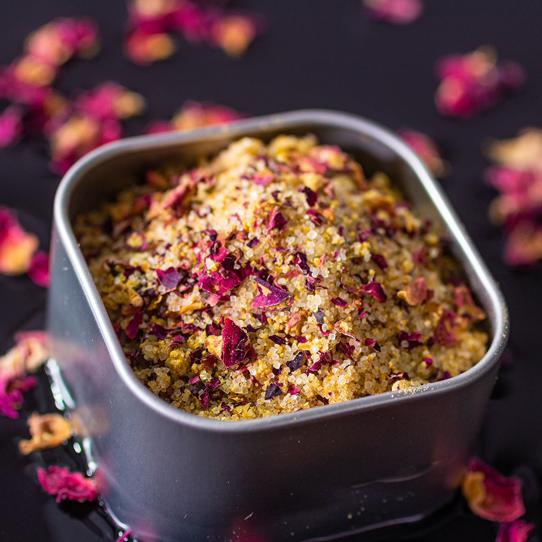 Florida Sunshine Sugar in square tin surrounded by rose petals