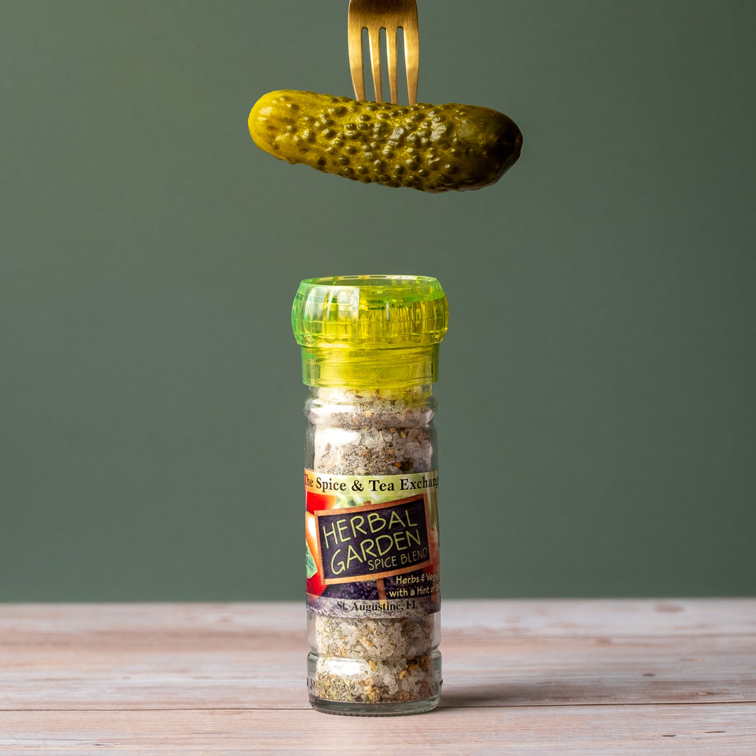 Herbal Garden Spice Blend on counter with dill pickle on fork above it