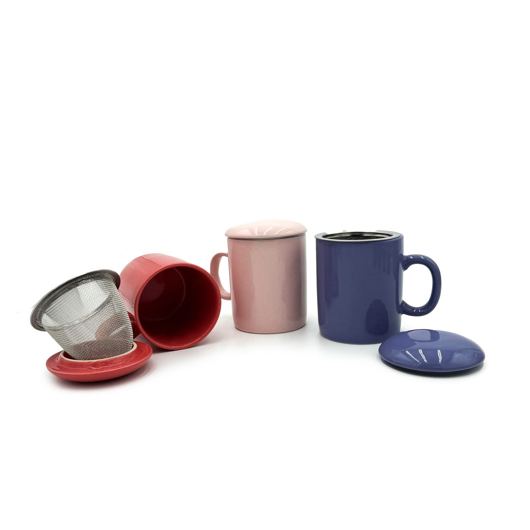 Periwinkle Infuser Mug displayed with red and pink mugs