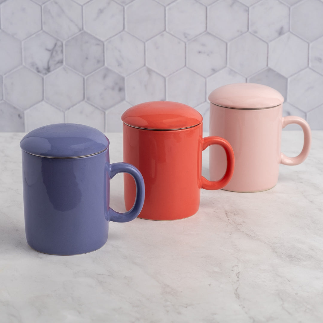 Rosewater Infuser Mug displayed with red and blue mugs